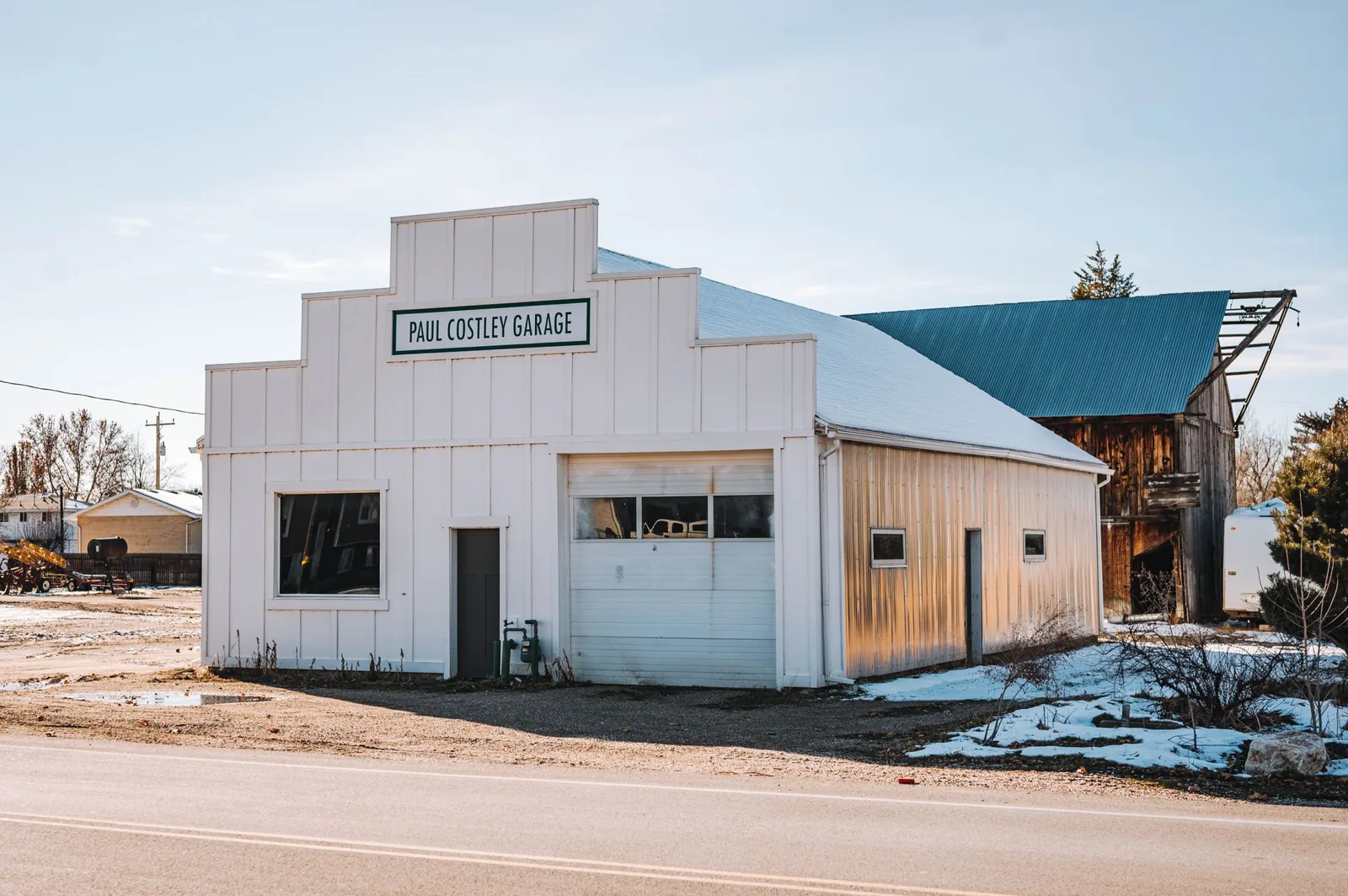 Pole barn vs garage side-by-side comparison on a rural property