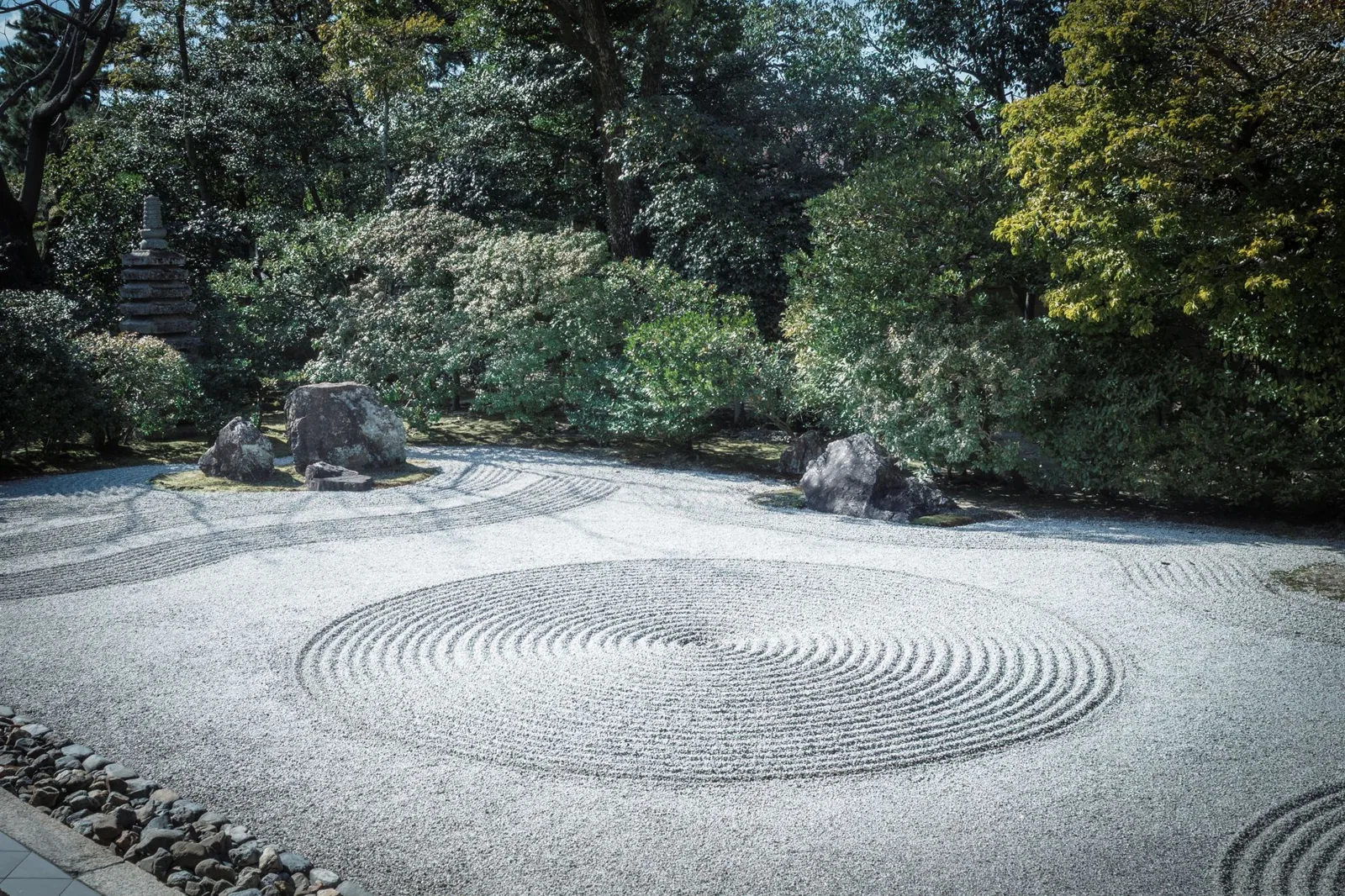 rock garden ideas — layered boulders with alpine plants and gravel