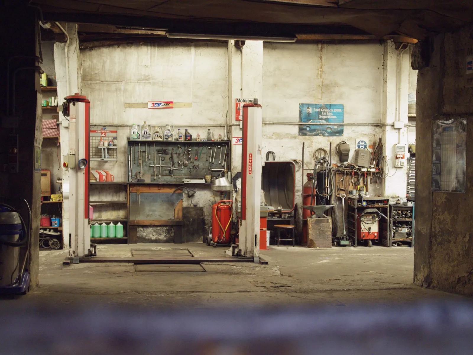 a detached single-car garage with a roll-up door