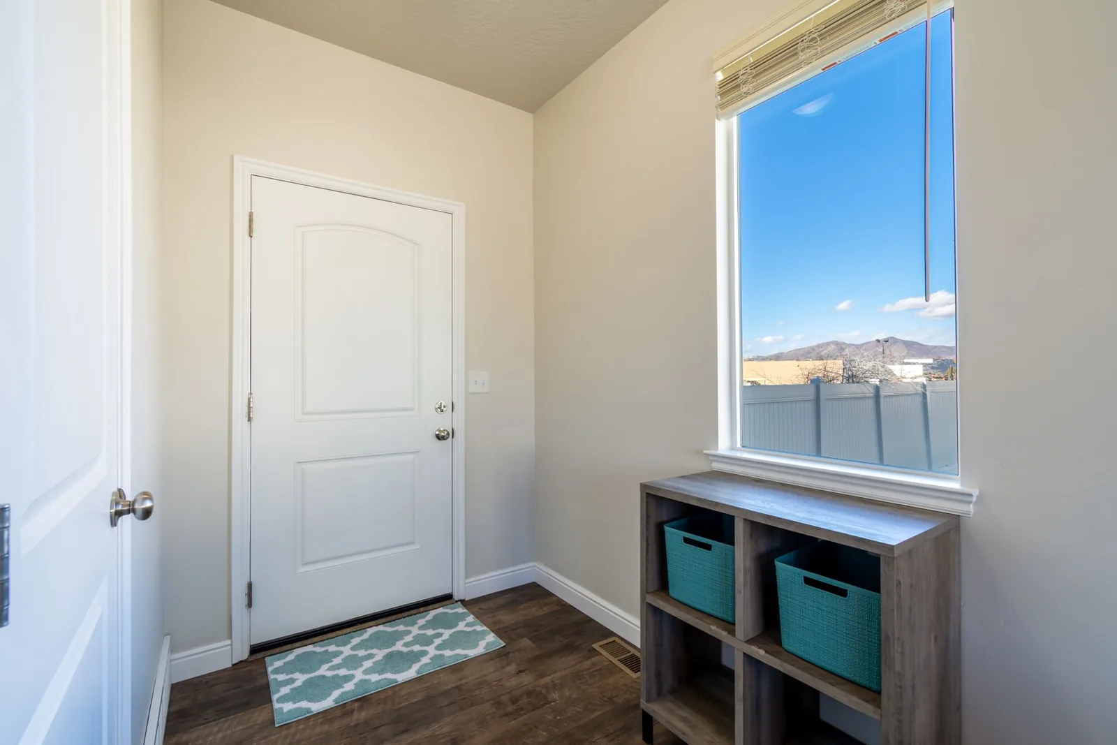 Mudroom ideas featuring a bench, hooks, and basket storage